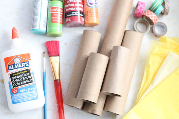 cardboard rolls, paint, glue, paintbrushes, washi tape, tissue paper